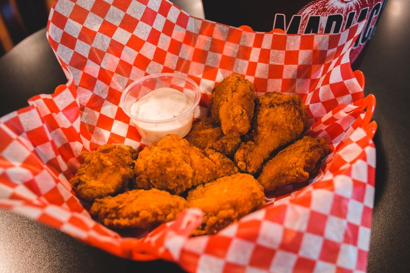 Crispy chicken wings with buffalo sauce and blue cheese dip