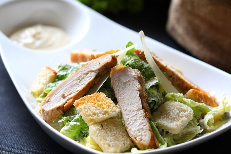 Fresh Caesar salad with romaine lettuce croutons and parmesan